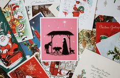 many christmas cards are piled on top of each other