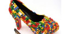 a pair of high heeled shoes made out of legos is shown next to a shoe