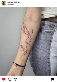 a woman's arm with a bird tattoo on the left side of her arm