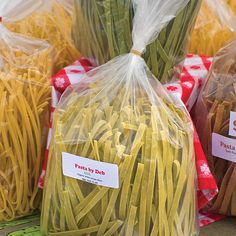 several bags of pasta sitting on top of a table