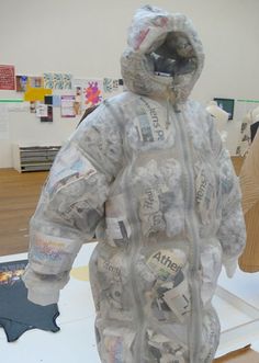 a person in a jacket made out of newspaper