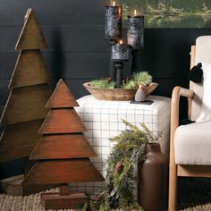 a living room decorated for christmas with candles and ornaments on the table next to it