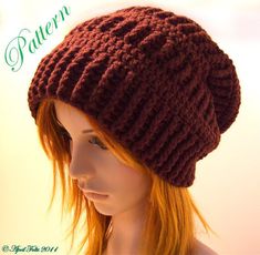 a mannequin head wearing a brown knitted hat