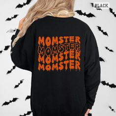 Momster Sweatshirt, Halloween Sweatshirt, Momster Halloween Sweatshirt, Funny Halloween Crewneck Sweatshirts for Women, Halloween Sweater, Halloween Shirts for Women, Halloween Gifts, Fall Sweatshirt, Halloween Mom Sweatshirt, Mombie ♥PRODUCTION TIME: 1-3 days (usually 2 days) ♥SHIPPING TIME: 2-5 days (usually 3 days) ♥PRODUCT DESCRIPTION: Gildan 18000 Unisex Sweater Super soft cotton and excellent quality print makes. 50% cotton, 50% polyester (fiber content may vary for different colors) Medium-heavy fabric blend (8.0 oz/yd² (271.25 g/m Runs true to size ♥ CARE INSTRUCTIONS: Machine wash: warm (max 30C or 90F); Non-chlorine: bleach as needed; Tumble dry: low heat; Don't iron; Do not dry clean ♥ PRINTING METHOD: DTG printing method is used for these Sweaters. A process of printing on text Black Halloween Graphic Print Sweatshirt, Spooky Black Halloween Sweatshirt, Black Long Sleeve Horror Sweatshirt, Black Letter Print Fun Sweatshirt, Halloween Novelty Tops With Funny Text, Halloween Horror Long Sleeve T-shirt, Spooky Black Sweatshirt With Graphic Print, Black Halloween Sweatshirt With Crew Neck, Halloween Novelty Tops With Letter Print