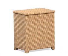 an outdoor wicker storage box with lid