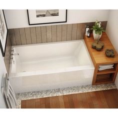 a bathroom with a sink, bathtub and towel rack