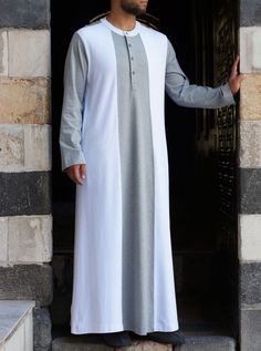 Flat, round collar Buttoned neck opening Side slit pockets Contrast colors Item Code: mG0421 Model is 184cm (6 feet) and wearing size L Jalabia For Men, Kanzu Wear, Jubbah Men, Latest African Wear For Men, Indian Wedding Clothes For Men, African Wear For Men, Native Dress, African Attire For Men, Classy Outfits Men