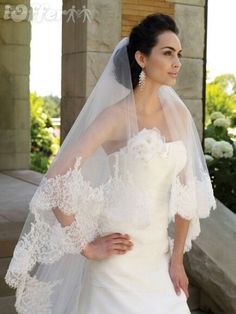 a woman in a wedding dress with a veil on her head and an advertisement for ebay