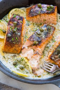 salmon with capers and lemon slices on a plate