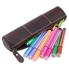 a leather case filled with lots of different colored pens