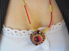 "This beautiful Clear Red Vintage Rhinestone Earring came straight from Grandma's jewelry box. Valentine Mother's Day Christmas Holiday New Years. Great with a little black or red dress for a night on the town. Opera?  It has a round red glass cabachon center set in gold toned metal surrounded by 26 small square cut sparkly red Rhinestones and 2 round red glass faceted stones. The focal component measures 1 1/4\" in length. There are minor chips on the bottom round faceted stone which is not noticeable. It is strung on gold colored 49 strand wire for strength and flexibility along with gold colored Toho seed beads and tiny red glass seed beads. . The necklace measures 23 1/2' in length and is finished with a small gold colored toggle clasp. One bracelet has a round red glass bead centered Traditional Red Heart-shaped Jewelry, Handmade Jewelry For Valentine's Day Party, Vintage Jewelry For Celebration With Jewels, Red Beaded Jewelry For Anniversary, Vintage Jewelry For Valentine's Day Party, Traditional Jewelry For Valentine's Day Celebration, Jeweled Pendant Jewelry Gift, Jeweled Jewelry Gift With Round Beads, Traditional Adjustable Jewelry For Valentine's Day