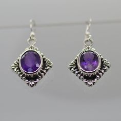 "Beautiful Faceted Purple Amethyst gemstones set on sterling silver earrings Material: Sterling Silver 925 Amethyst size: 9X10mm Stamped \"925\" Comes with jewelry box ready to ship"