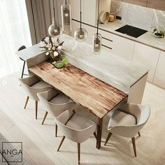 a wooden table surrounded by white chairs in a room with marble counter tops and cabinets