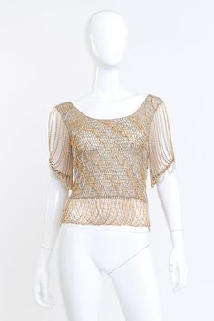 Loris Azzaro Metallic Crochet Knit Chain Drape Top front on mannequin @RECSS LA Gold Embellished Evening Blouse, Gold Short Sleeve Top With Sequins, Gold Short Sleeve Tops With Sequins, Gold Sequined Short Sleeve Top, Gold Sequin Short Sleeve Top, Elegant Short Sleeve Mesh Top For Evening, Glamorous Gold Short Sleeve Top, Chic Embellished Gold Tops, Gold Embellished Summer Top