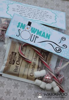 some candy wrapped in plastic and sitting on top of a table with a snowman sign