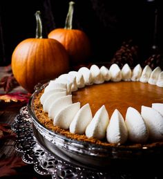 a pumpkin pie with white meringue and marshmallows on the top