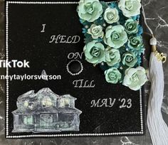 a decorated graduation cap with flowers on it