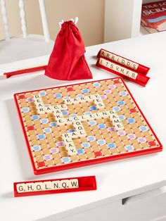 a scrabble board game on a white table