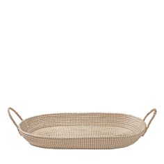 an oval woven tray with handles on the bottom and sides, made from natural materials