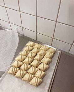 a bunch of cookies that are sitting on a cookie sheet