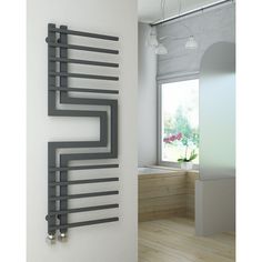 a bathroom with a wall mounted towel rack