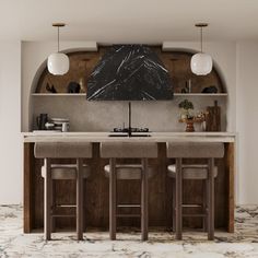 a kitchen with marble counter tops and bar stools in front of an arched wall