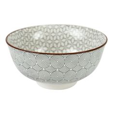 a white and brown bowl with swirl designs on the rim, sitting in front of a white background