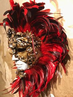 This masquerade mask for man and woman belongs to our collection of feathers' masks. These masks have a crown of red and black feathers. It is perfect for decoration or any masquerade party, Halloween costume, pro or event in Venice or elsewhere during Carnival. This mask can be gently bent to form to your face and ties in the back with two soft matching ribbons. Since the mask is handmade, your mask could be lightly different from the one in the picture. This mask is made on paper mache,decorat Red Fantasy Style Masks And Prosthetics For Events, Red Fantasy Masks And Prosthetics For Events, Red Fantasy Style Masks And Prosthetics For Fantasy Events, Red Fantasy Masks And Prosthetics For Fantasy Events, Artistic Red Masks And Prosthetics For Costume Party, Artistic Red Masks For Costume Party, Artistic Red Mask For Costume Party, Red Fantasy Masquerade Mask For Costume, Artistic Red Masks And Prosthetics For Mardi Gras