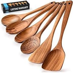 six wooden spoons lined up next to each other