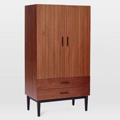 an armoire with two drawers and one drawer on the bottom, in walnut wood