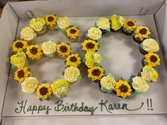 two cupcakes in the shape of sunflowers are arranged into a wreath