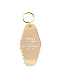 a keychain with the words tossed salads and scrambled eggs written on it