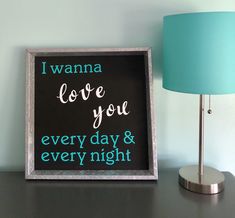 a sign that says i wanna love you every day and every night on it next to a lamp