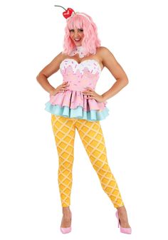 a woman in pink wig and yellow tights posing for the camera with her hands on her hips