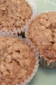 three muffins sitting on top of a green plate