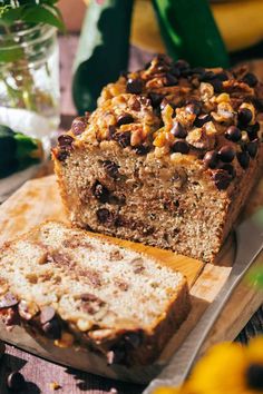 a loaf of banana nut bread sitting on top of a cutting board