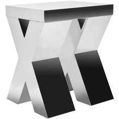 a modern white and black side table with x design on the top, as well as two smaller pieces of metal