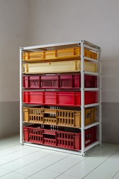 several plastic containers stacked on top of each other in a room with tile flooring