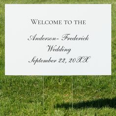 a welcome sign in the grass for someone to have their wedding ceremony written on it