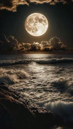 the full moon is shining over the ocean and waves in the water, with dark clouds above