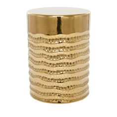 a gold - plated metal vase with wavy designs on the outside and inside sides