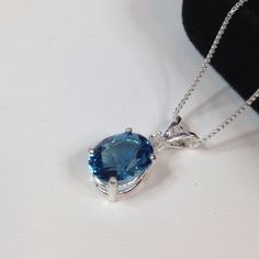 "Gorgeous London Blue Topaz & White Sapphire Necklace * Oval Cut London Blue Topaz measures 8x6mm * Brilliant Cut White Sapphire Accent * 1.3cts Total Weight * Solid Sterling Silver * 16\" or 18\" Sterling Silver Chain Included - Select Your Length Hallmarked & Gift Ready! Matching Earrings & Ring Available TIMELESS, BEAUTIFUL & UNIQUE FINE ART JEWELRY" White Sapphire Necklace, Beautiful London, Trending Jewelry, Fine Art Jewelry, Sapphire Necklace, Sterling Silver Necklace Pendants, London Blue Topaz, London Blue, White Sapphire