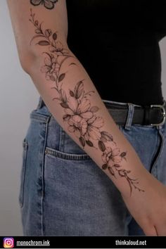 a woman with a flower tattoo on her arm