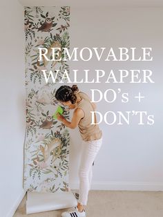 a woman standing in front of a wall with the words removable wallpaper do's and don'ts