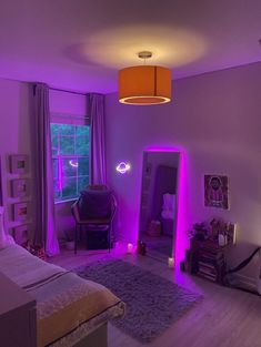 a bedroom with purple lighting and a bed