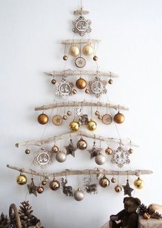 a christmas tree made out of branches and ornaments