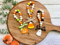 a wooden platter with halloween decorations on it