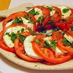 tomatoes and mozzarella on a plate ready to be eaten