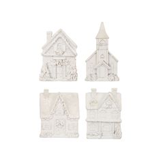 four white ceramic houses are shown on a white background