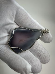 Here Is a Beautiful Swazi Agate Cabochon Silver Wire Wrap Pendant from Mozambique, Africa, and was cut by us. The Wire Wrap was done by my sister Sammantha Aus and is wrapped in Sterling Silver.    This Cabochon measures 2 inches long, 1 1/2 inches at the widest and 1/4 inch thick. We Will have a Huge Selection of some of the Finest Minerals and Arkansas Crystals and Rare Cabochons. If you have any ? then please ask. I'd be glad to answer all ?'s. Thanks for looking. Large Agate Stone Gemstone For Gift, Large Agate Gemstone As A Gift, Unique Agate Gemstones For Gift, Handmade Artisan Agate Gemstones, Arkansas Crystals, Mozambique Africa, Wire Wrap Pendant, Fine Minerals, Agate Cabochon